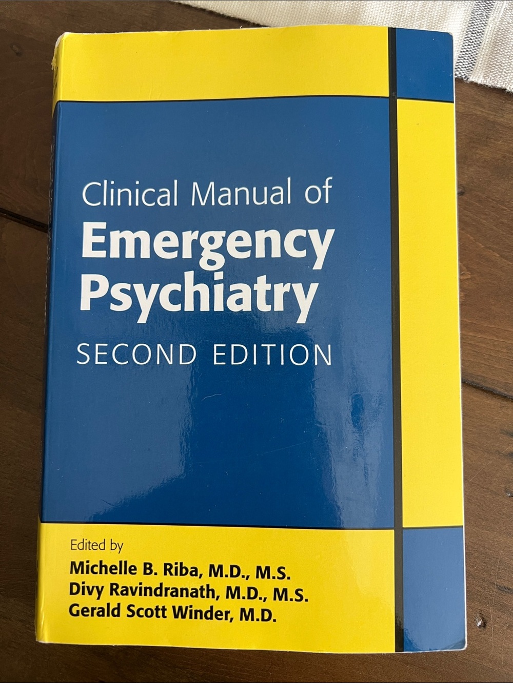 Clinical Manual of Emergency Psychiatry — Blue and Yellow Coffee Table Book